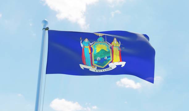 istock New York (USA) flag waving against blue sky 1126657297