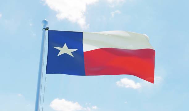 istock Texas (USA) flag waving against blue sky 1126658131
