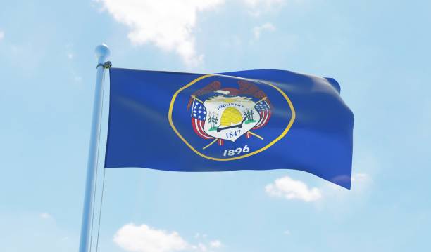 istock Utah (USA) flag waving against blue sky 1126658138
