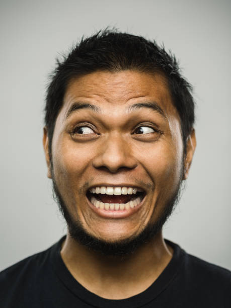istock Real malaysian young man with very excited expression looking to the side 1126659708