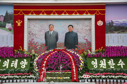 April 14, 2018. Pyongyang, North Korea.\nThe people of North Korea pay their respects to the leaders before many festivals and opening. It is possible to see huge propaganda posters in the streets of North Korea's capital, Pyongyang.