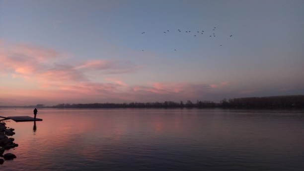 Sport fisherman fishing at Danube river in Belgrade, Serbia at sunset