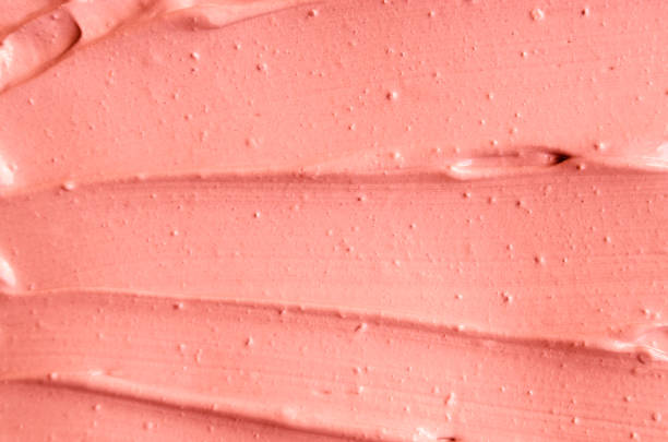 istock Soft pink cosmetic clay (facial mask, cream) texture close up, selective focus. Abstract background with brush strokes. 1126662446