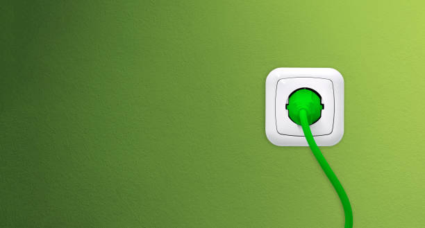 녹색 벽에 플러그와 콘센트 - electric plug electricity power cable power 뉴스 사진 이미지