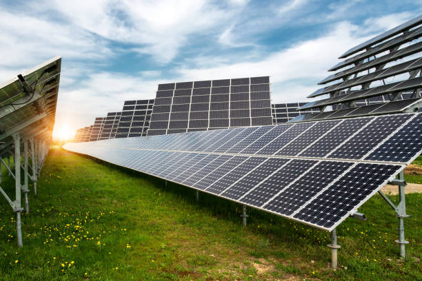 istock Solar panels, photovoltaics, with sun tracking systems -  alternative electricity source, concept of sustainable resources 1126667719