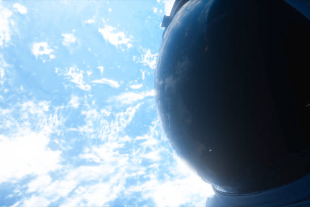 istock A lone astronaut looks at the planet earth 3d illustration 1126668158