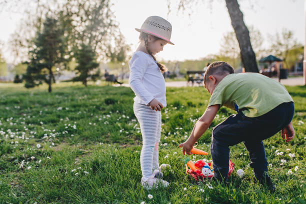 istock Brother and sister enjoying easter egg hunt 1126668906