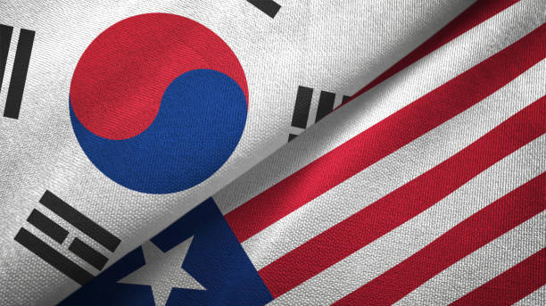 istock Liberia and South Korea two flags together textile cloth, fabric texture 1126668966