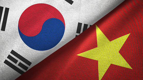 Vietnam and South Korea flags together textile cloth, fabric texture