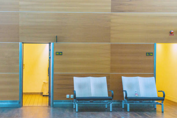 Bathrooms in Copenhagen Airport  with seats outside.