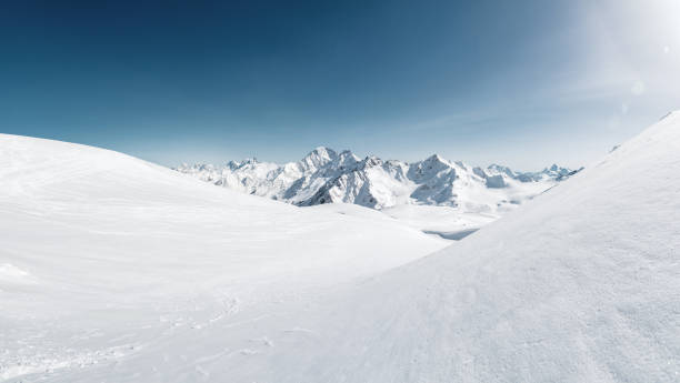 istock Sun over winter mountains covered with snow. Untouched freeride slope. Snow covered glacier 1126672099
