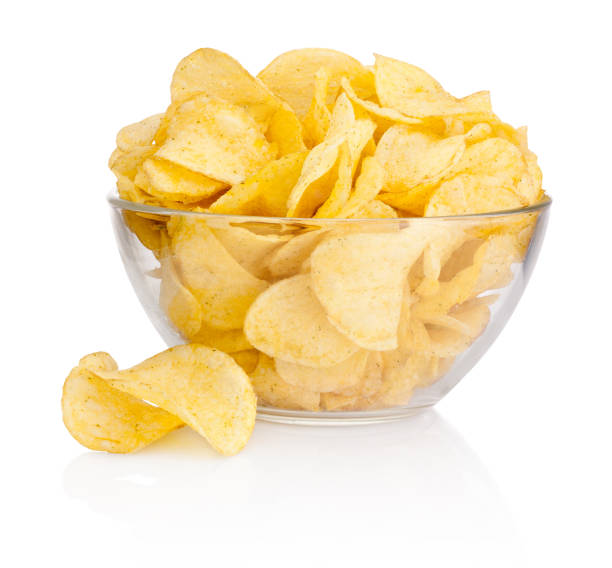 istock Potato chips in glass bowl isolated on white background 1126673837