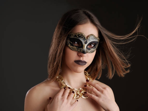 istock Young woman with Venetian mask. 1126674493