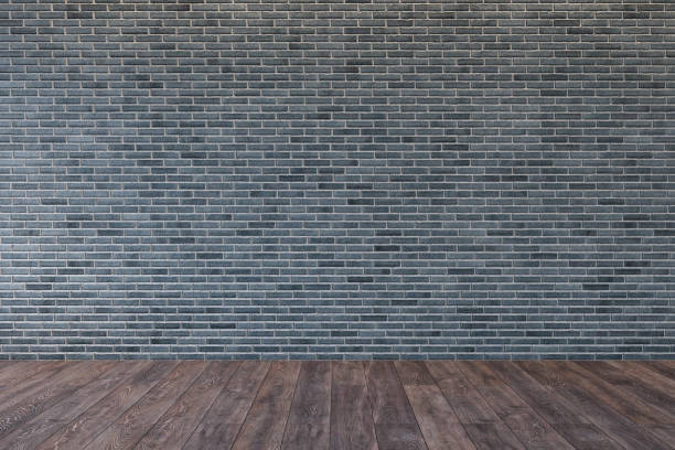 istock Loft interior with blank gray brick wall and wooden floor. 3d render illustration mock up. 1126674583