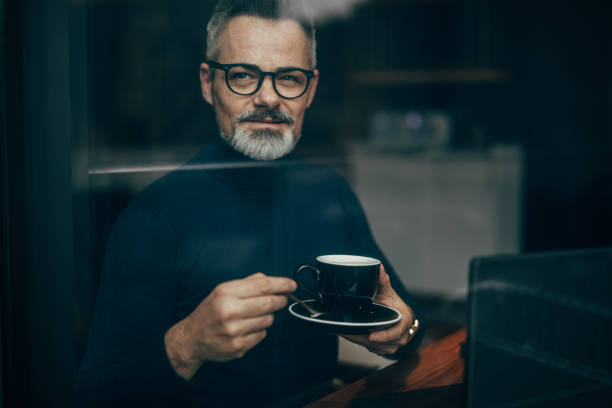 Handsome mature gentleman on coffee break