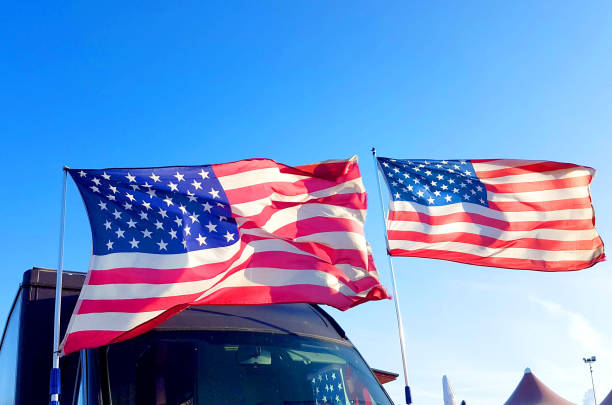 istock US flag flies in the blue sky on Thanksgiving Day 1126675127