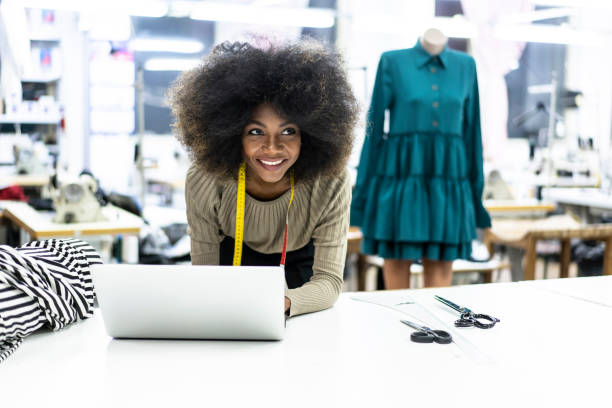 istock Young afro woman in sewing workshop 1126676851