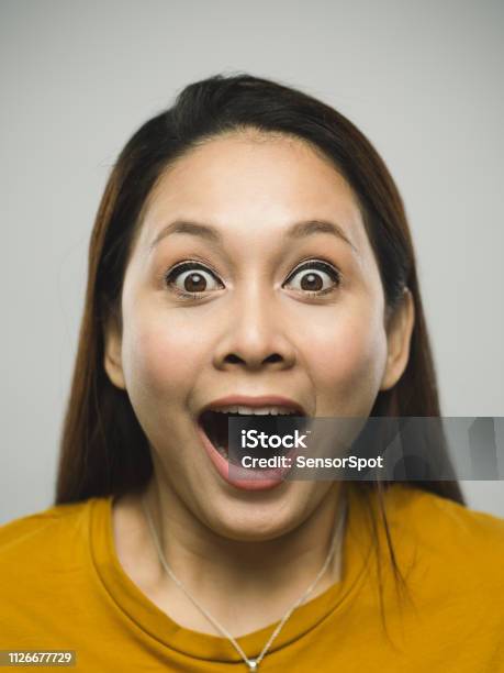 Real Malaysian Young Woman With Surprised Expression Stock Photo - Download Image Now