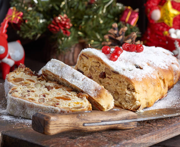 istock Stollen a traditional European cake with nuts and candied fruit, is dusted with icing sugar 1126678270