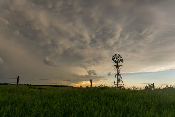 istock Nebraska windmill with beautiful mammatus clouds at sunset 1126678313