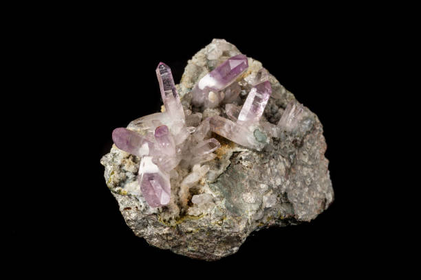 istock Macro mineral stone Amethyst crystals in rock on a black background 1126679033