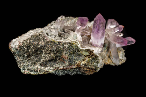 istock Macro mineral stone Amethyst crystals in rock on a black background 1126679184