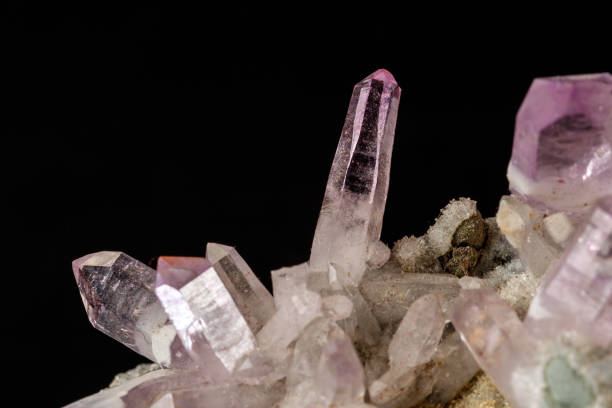 istock Macro mineral stone Amethyst crystals in rock on a black background 1126679836
