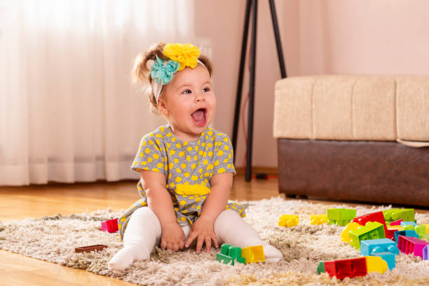 istock Playful baby girl smiling 1126682132
