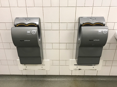 Amersfoort, the Netherlands - Januari 27, 2019: Two grey Dyson Airblade hand dryers.