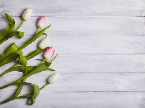 istock Bouquet of tulips on a  wooden table. 1126686979