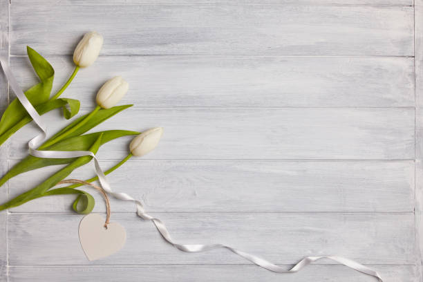 istock Bouquet of tulips on a  wooden table. 1126687010