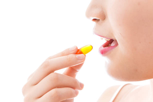 istock Young woman taking medicine 1126688211