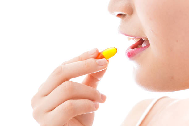 istock Young woman taking medicine 1126688215