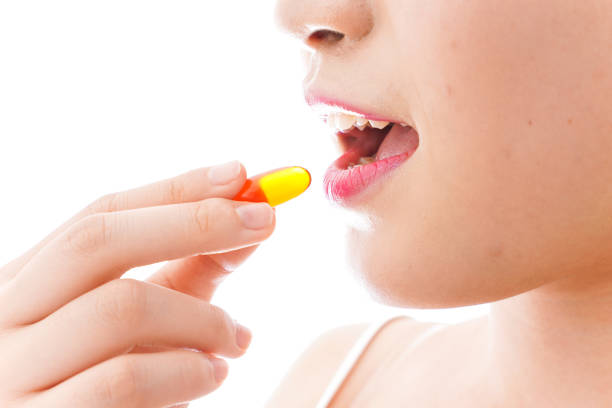 istock Young woman taking medicine 1126688221