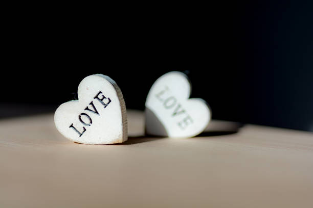 istock two hearts with the inscription love on the table 1126688718