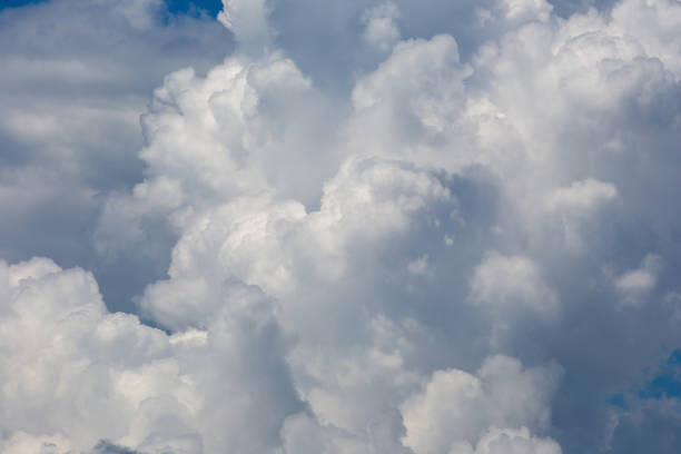 istock White fluffy clouds in the blue sky background 1126690859