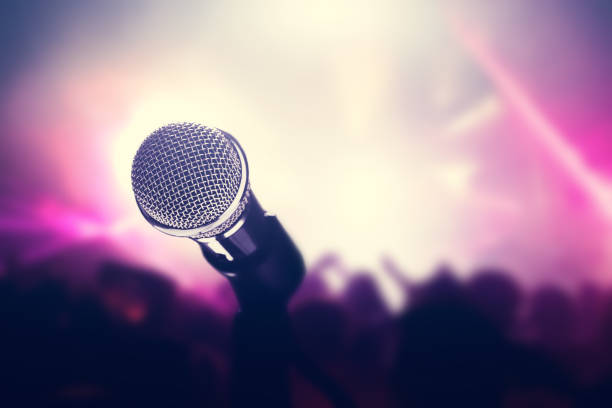 Microphone on stage, crowd of people in the club. Microphone on stage, crowd of people in the club. Nightlife, entertainment. Concert and music industry. audition photos stock pictures, royalty-free photos & images