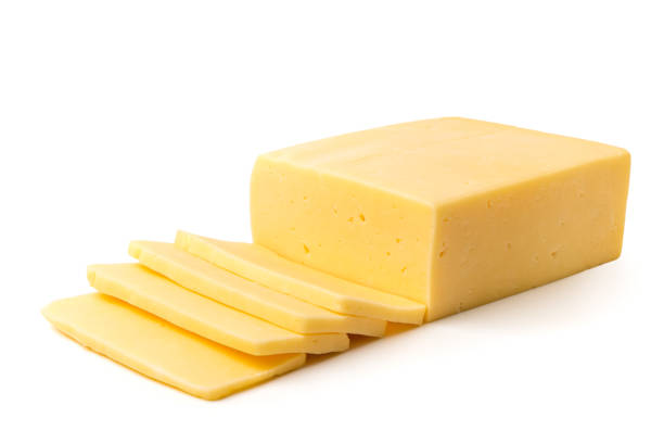 istock Cheese cut into slices on a white, closeup. 1126695252