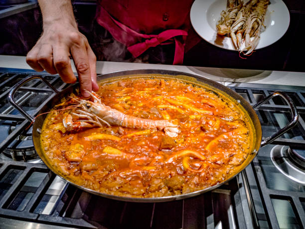 istock Pot with paella in cooking 1126695520