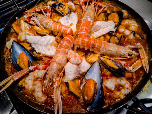 istock Pot with paella in cooking 1126695652