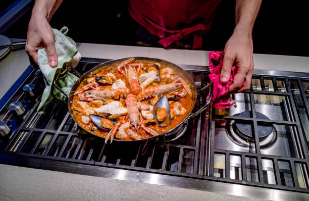 istock Pot with paella in cooking 1126695675