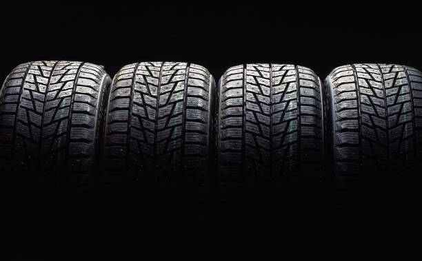 istock new car tires, studio shot 1126697725