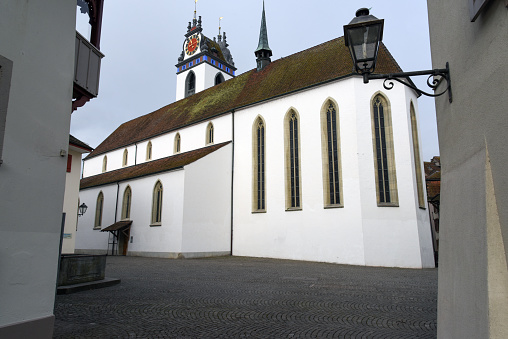 The Church of Aarau was built between 1471 and 1478. The church was realized in late gothic style. The Building is located in the north-west of Aarau City. The Image was captured during Winter Season on a cloudy day.