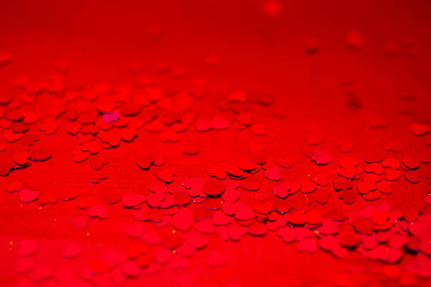 istock Red hearts confetti texture. Happy Valentines day background. 1126699349