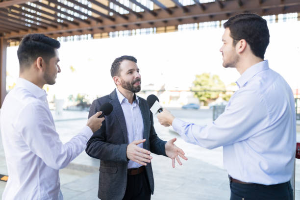 istock Businessman Giving Speech At An Outdoors Event 1126701020