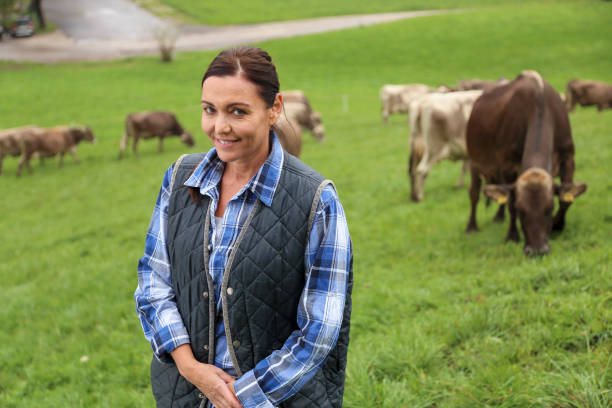 istock Female farmer portrait on pasture 1126701187