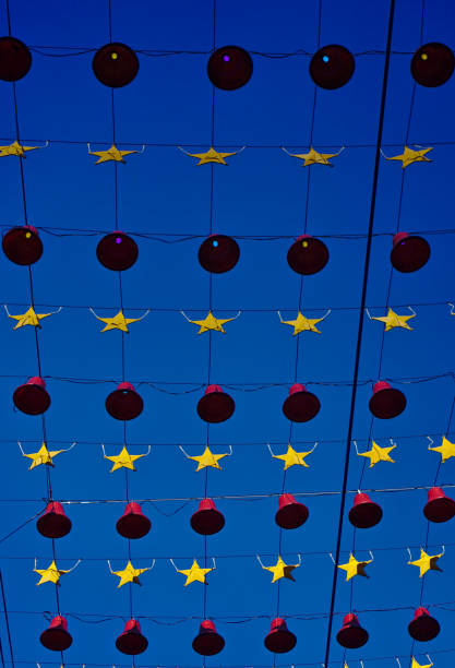 istock Red bells and yellow stars hanging on rope 1126703276
