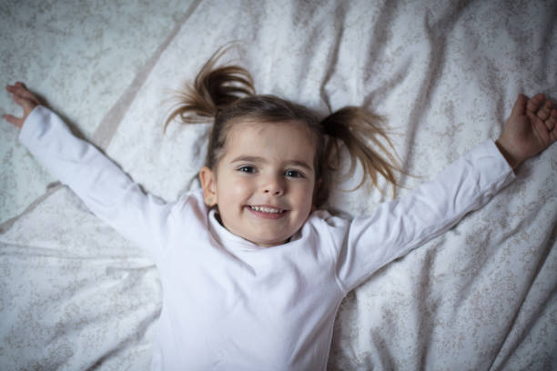 Portrait of cute girl on beach holiday sitting at the veranda and smiling to camera