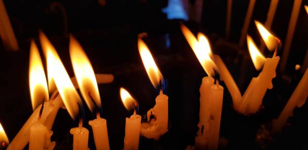 istock Candles burning in the dark 1126705192