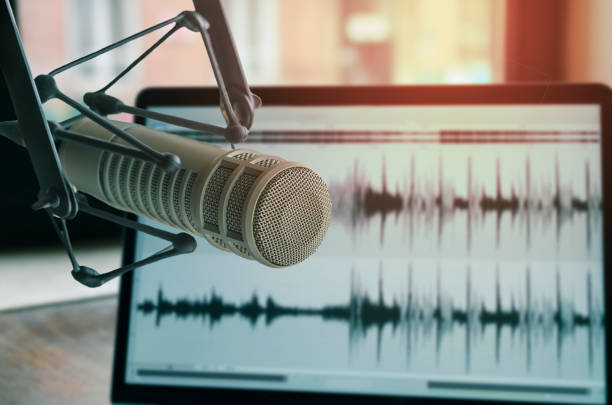 Professional microphone Professional microphone and sound waveform on screen podcasting photos stock pictures, royalty-free photos & images